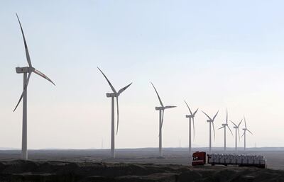 A truck moves past power-generating wind turbines on the outskirts of Cairo, Egypt, November 15, 2018. Reuters