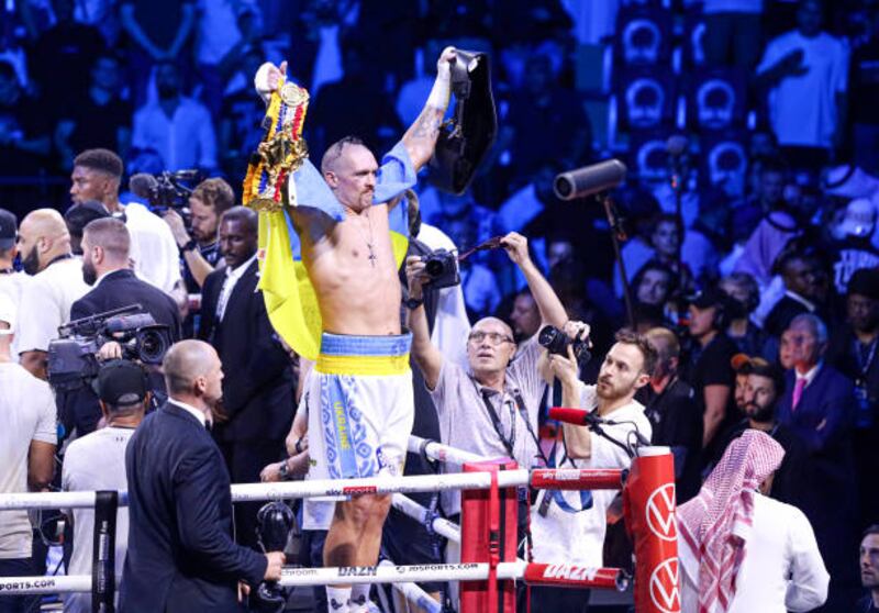 Oleksandr Usyk of Ukraine celebrates after beating Britain's Anthony Joshua in their heavyweight world title rematch at the King Abdullah Sports City Arena in Jeddah. Getty