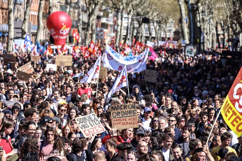 Protesters march for the 11th day after the French government pushed a pensions reform through parliament without a vote. AFP