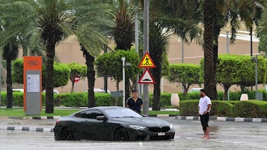 A car is stranded on a flooded street in Dubai on May 2 as heavy rains returned two weeks after record downpours. AFP