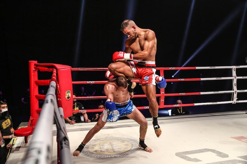 Ilyass Habibali lands a flying-knee on Haroun Baka en route to victory in the inaugural K-1 Combat at Festival Arena in Dubai on Friday. Courtesy UAE Muaythai and Kickboxing Federation