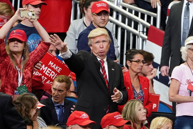 A man dressed as Donald Trump waves before a campaign kick off rally at the Amway Center in Orlando, Florida. Reuters