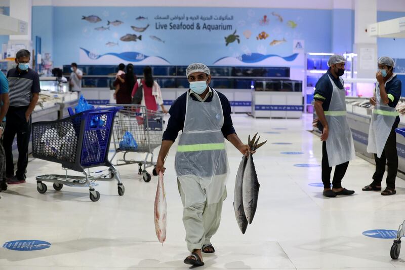 People shop for meat, fruit and veg and fish during Eid at Deira Waterfront Market, Dubai on May 13th, 2021. Chris Whiteoak / The National. 
Reporter: N/A for News