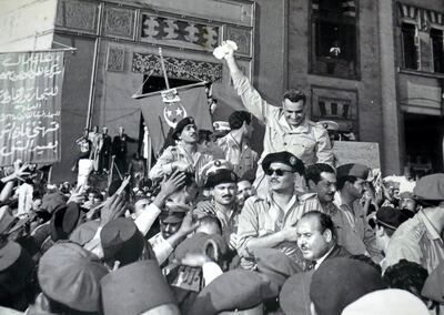 Gamal Abdel Nasser and members of the RCC, welcomed by cheering crowds in Alexandria 1954, after the signing of the British withdrawal order. (Salah Salem seated in front of Nasser with sunglasses), Kamal el-Din Husseini (behind Salem), Anwar Sadat (only partially visible, behind Husseini), Abdel Hakim Amer (standing behind Nasser, face not seen). Gamal Abdel Nasser (1918 - 1970), President of Egypt, serving from 1956 until his death in 1970. Nasser led the 1952 overthrow of the monarchy and introduced far-reaching land reforms the following year. (Photo by: Universal History Archive/UIG via Getty Images)