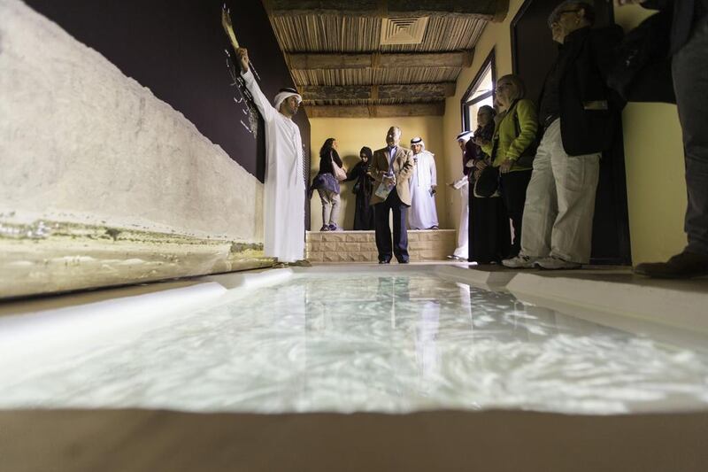 Visitors at the west gate exhibition at the Al Ain oasis as part of the My Old House tour.