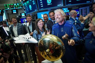 Richard Branson, founder of Virgin Galactic, rings a ceremonial bell on the floor of the New York Stock Exchange to promote the first day of trading of Virgin Galactic Holdings shares on October 28, 2019, in New York. Virgin Galactic went public in 2019 via an SPAC merger with Social Capital Hedosophia. Getty Images