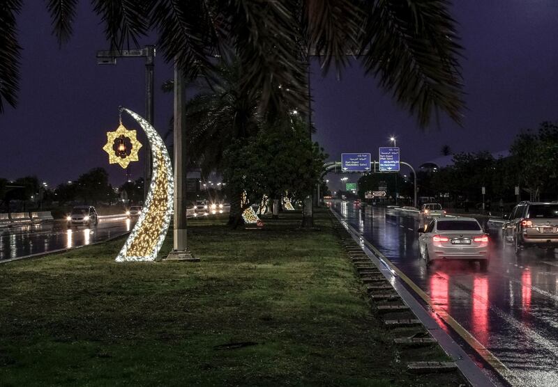 Abu Dhabi, United Arab Emirates, April 15, 2020.  The newly installed Ramadan lights on the Corniche during the rains.Victor Besa / The NationalSection:  NAFor:  Standalone/Stock Images