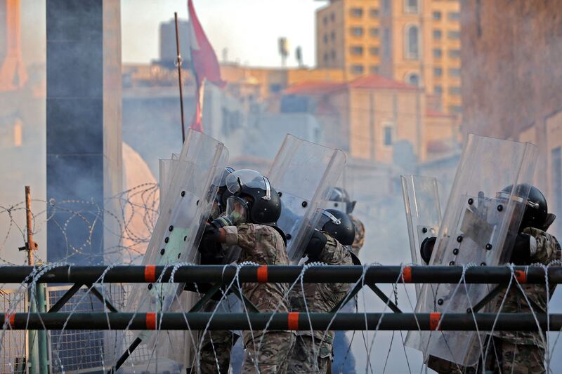 The security forces clash with demonstrators near Lebanon's parliament building in Downtown Beirut.