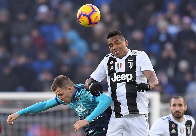 Juventus' Alex Sandro in action with Atalanta's Josip Ilicic REUTERS