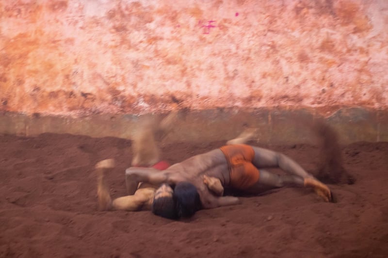 The wrestlers train on red soil, and it takes at least Rs 50,000 yearly to maintain the wrestling pits. Turmeric, curd, ghee, spices, and other natural curatives are added to the soil. Sanket Jain for The National