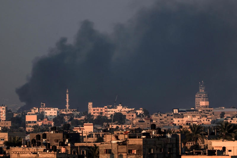 Smoke rises from Israeli strikes on Khan Younis in southern Gaza, photographed from Rafah, where a ground offensive is looming. AFP