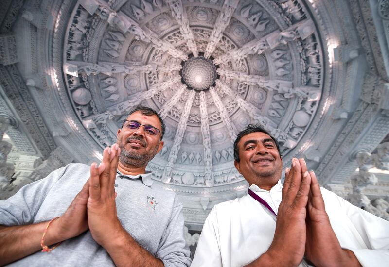 From left, Nishith Raval, senior project manager, and Sanjay Parikh, head of procurement and design, at the temple. Victor Besa / The National