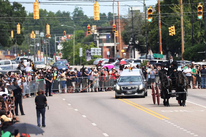The horse-drawn carriage carries the body of civil rights icon. AFP