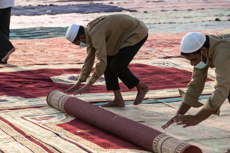 Eid prayers, also known as Salat al-Eid and Șālat al-'Īdayn, is the special prayers (salah) offered to celebrate the Islamic festival at the end of the Holy Month of Ramadan. Traditionally it is held in an open space, Eidgah, such as an allocated spcae or field specifically available for prayer. The UAE Authorities allowed communal Eid prayers again this year with a strict policy of social distancing anf a 15 minite prayer access throughout the UAE after last years locdown due to the Covid - 19 pandemic. Worshippers attend the Eid Prayer at the Umm Suquim Eid prayer grounds on May 13 th, 2021. 
Antonie Robertson / The National.
Reporter: None for National.