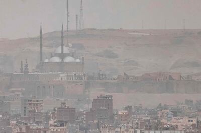 The Mosque of Mohammed Ali and the Cairo Citadel are partially obscured by a sandstorm over Cairo on June 1. AFP 