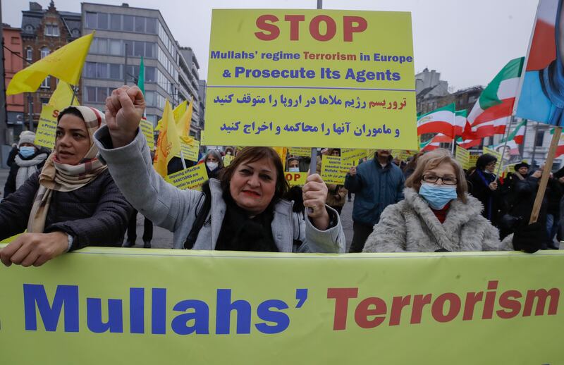 Demonstrators gather in Antwerp, Belgium, where three people convicted of plotting to bomb a rally by the Iranian opposition launched an appeal. EPA