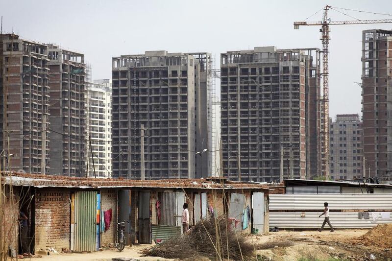 Measures introduced by the Narendra Modi government, including easing foreign direct investment and a possible drop in interest rates should encourage reluctant buyers to enter the market. Kuni Takahashi / Bloomberg News