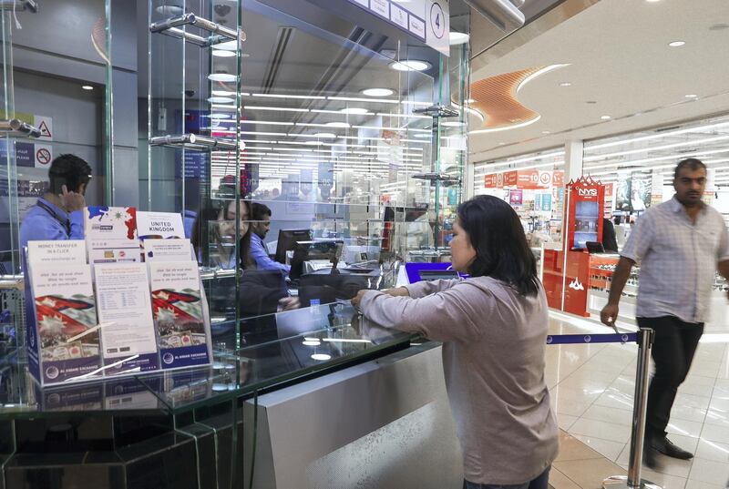 Abu Dhabi, UAE.  March, 11, 2018.  A Filipino citizen sends money back home to the Philippines from a remittance centre in Abu Dhabi.
Victor Besa / The National
National