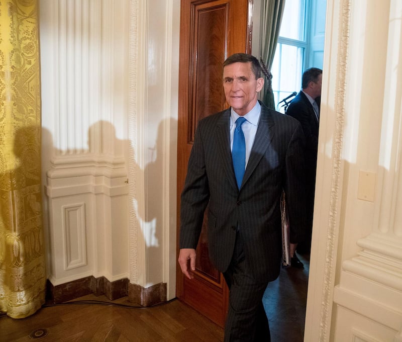 FILE - In this Jan. 22, 2017 file photo, National Security Adviser Michael Flynn arrives for a White House senior staff swearing in ceremony in the East Room of the White House, in Washington. President Donald Trump's former national security adviser has provided so much information to the special counsel's Russia investigation that prosecutors say he shouldn't do any prison time, according to a court filing Tuesday, Dec. 4, 2018, that describes Flynn's cooperation as "substantial." (AP Photo/Andrew Harnik, File)
