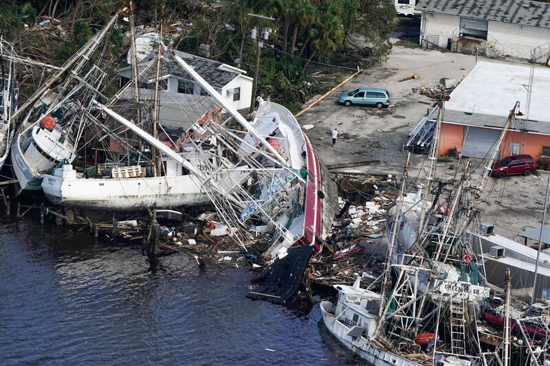 The storm wrought havoc at this marina, damaging boats. AP