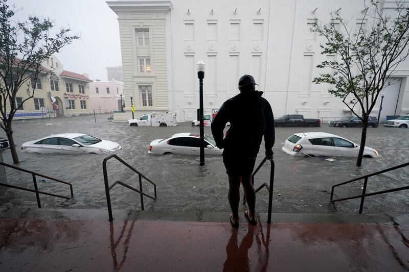 Floodwaters move on the street in Pensacola, Florida. Hurricane Sally made landfall near Gulf Shores, Alabama, as a Category 2 storm, pushing a surge of ocean water onto the coast and dumping torrential rain. AP Photo