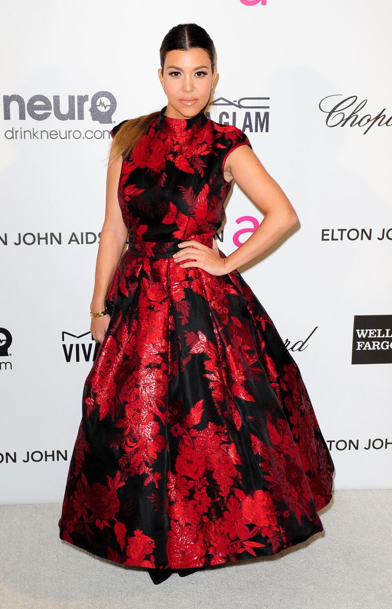 Kourtney Kardashian, in red and black floral Brian Rennie for Basler, arrives at the 2013 Elton John Aids Foundation Oscar Party in West Hollywood on February 24, 2013. Reuters