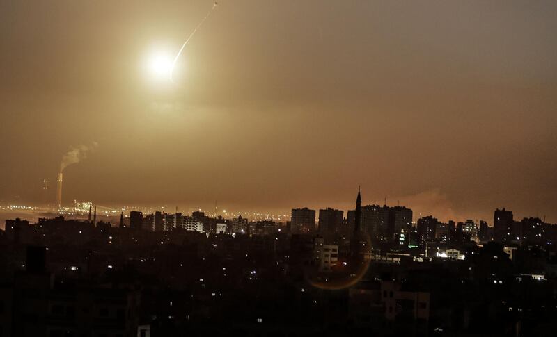 Missiles from the Iron Dome air defence system, designed to intercept and destroy incoming short-range rockets and artillery shells, from a position in the southern Israeli are seen from Gaza city on June 20, 2018. / AFP / MAHMUD HAMS
