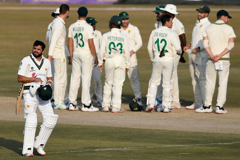 Pakistan's Azhar Ali walks back to the pavilion after his dismissal for 33. AFP