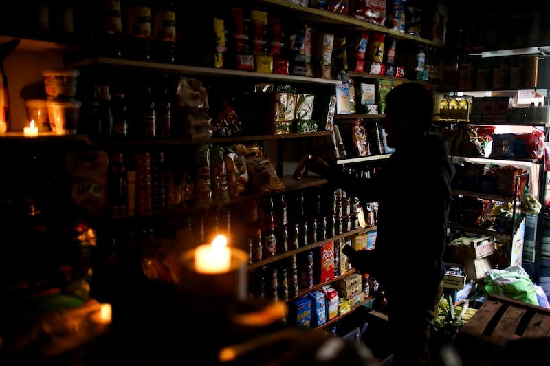 A vendor waits for customers during a national blackout, in Buenos Aires, Argentina.  Reuters