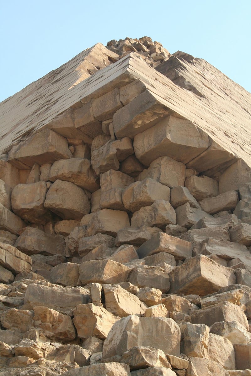 A damaged corner of the Bent Pyramid. It's the only remaining pyramid to retain most of its outer limestone casing. Courtesy Peter James