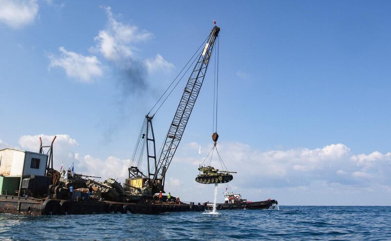 Three kilometres off the coast of the city of Sidon, a ship's crane manoeuvred the military hardware into place over the water before dropping them down to the seabed one after the other.