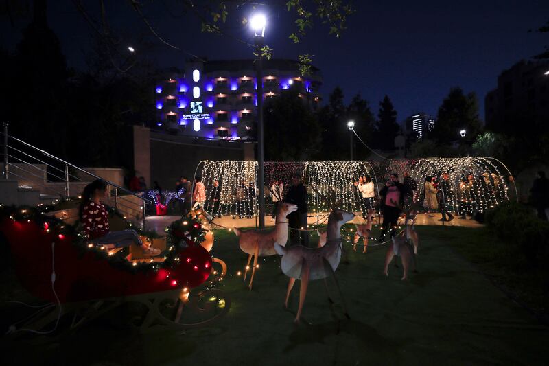 Palestinians visit the Christmas market in the West Bank city of Ramallah, marking the beginning of festive celebrations in the city