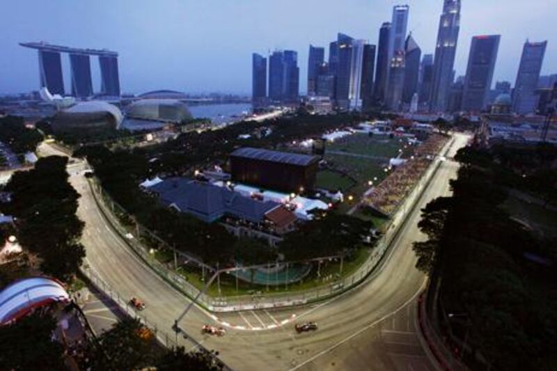 Formula One drivers steer their cars on the Marina Bay City Circuit, seen from Swissotel The Stamford, during the third practice session for Sunday's Singapore Formula One Grand Prix in Singapore, Saturday, Sept. 24, 2011. (AP Photo/Wong Maye-E)