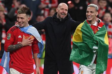 (L-R) Manchester United's Lisandro Martinez, manager Erik ten Hag, and Antony celebrate after winning the Carabao Cup final soccer match between Manchester United and Newcastle United, in London, Britain, 26 February 2023.   EPA / NEIL HALL