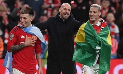 Left to right: Manchester United defender Lisandro Martinez, manager Erik ten Hag, and winger Antony celebrate after winning the League Cup final against Newcastle. EPA