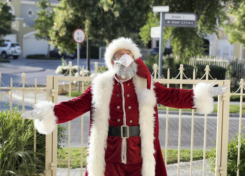 Dubai, United Arab Emirates - December 14, 2020: Lifestyle. Santa played by Keith Dallison. Santa is doing home visits with Covid-19 prevention measures in place and zoom calls to protect the children. Monday, December 14th, 2020 in Dubai. Chris Whiteoak / The National