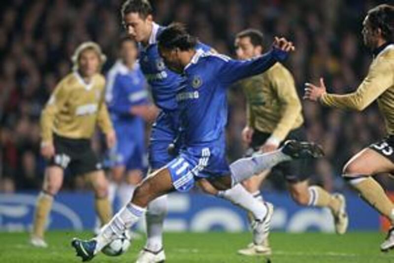 Chelsea's Didier Drogba scores aganist Juventus. He could be reunited with midfielder Michael Essien tonight.