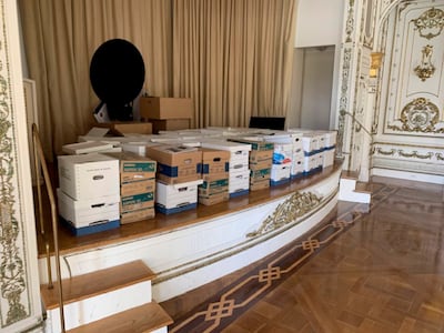 Boxes of records being stored on the stage in the White and Gold Ballroom at Trump's Mar-a-Lago estate in Palm Beach, Florida. AP