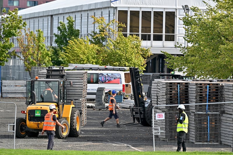 Construction workers at the site of the Cop26 climate summit in Glasgow. Queen Elizabeth II, Pope Francis and US President Joe Biden are among the high-profile people expected to attend. Getty Images