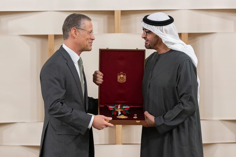 Sheikh Mohamed presents the First Class Order of Zayed II medal to Badr Jafar, chief executive of Crescent Enterprises. Abdulla Al Neyadi / Presidential Court