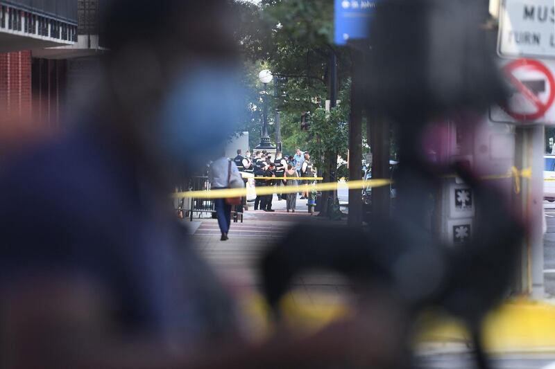 Police tape is seen behind a news camera on Pennsylvania Avenue near the White House in Washington, DC.  AFP