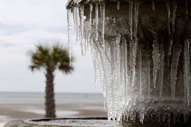 Icicles hang from the fountain in Biloxi, Mississippi. John Fitzhugh / The Sun Herald via AP