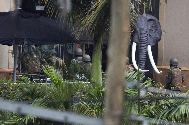 Kenyan soldiers enter the Westgate Mall through the main entrance. Despite Kenyan government assurances of success, an explosion and gunfire could be heard coming from the mall at around 6.30am, followed by the sustained chatter of automatic weapons for about a minute almost three hours later, according to Associated Press reporters at the scene.  Ben Curtis / AP Photo