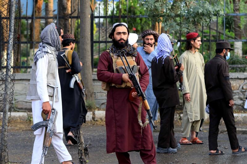 Taliban fighters on guard after a bomb attack on a mosque in Kabul on September 23. EPA