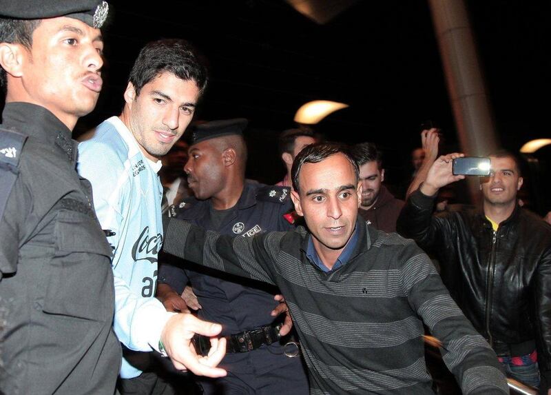 Luis Suarez arrives in Amman ahead of Wednesday's World Cup play-off between Uruguay and Jordan. Khalil Mazraawi / AFP