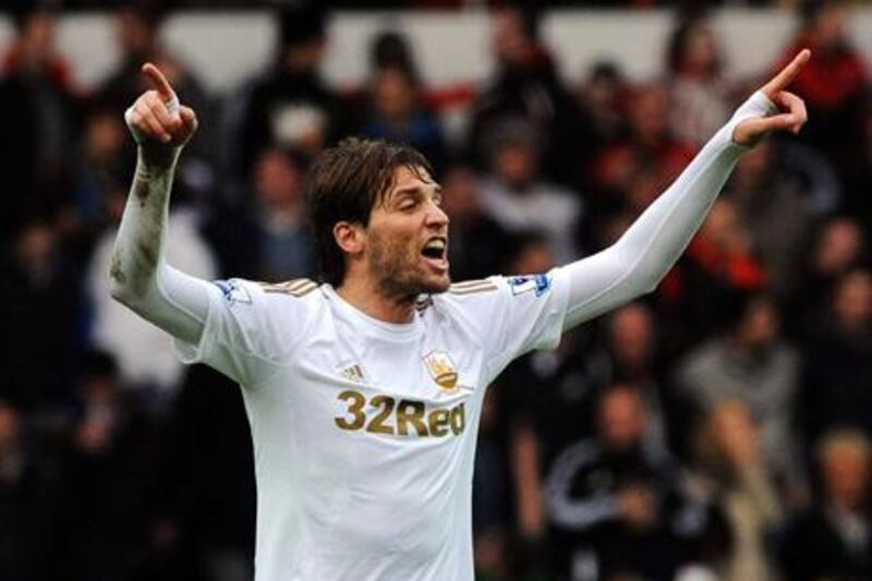Swansea City forward Michu celebrates his goal against Manchester United.