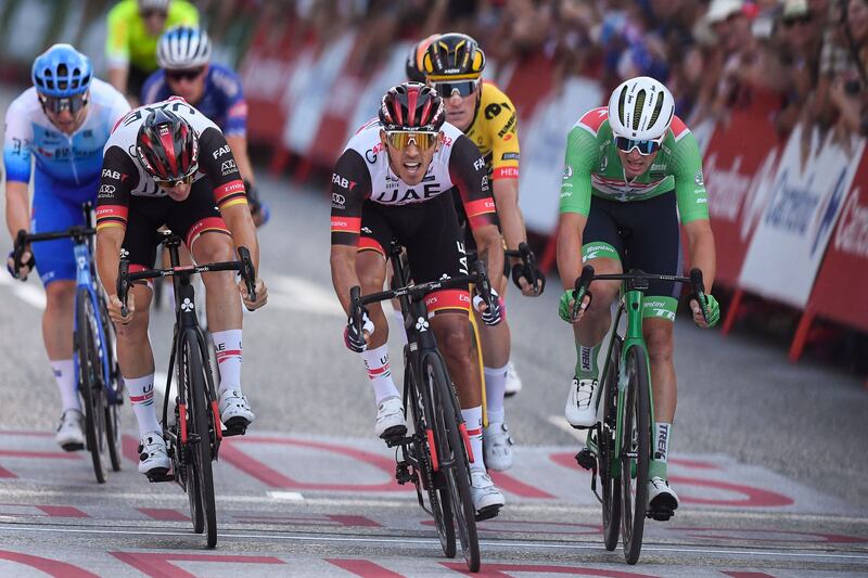 UAE Team Emirates rider Sebastian Molano, centre, wins the the 21st and final stage of the 2022 La Vuelta. AFP