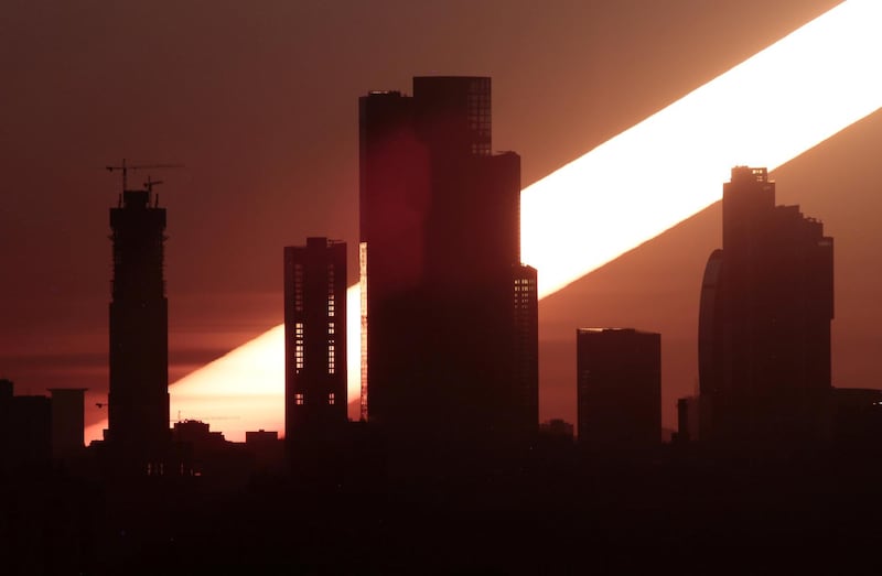 The sun rises behind the skyscrapers in Moscow, Russia. Anton Vaganov / Reuters