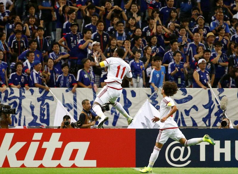 UAE's Ahmed Khalil (11) celebrates after scoring one of his two goals against Japan on Thursday. Kim Kyung-Hoon / Reuters