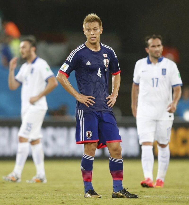 Keisuke Honda reacts during Japan's scoreless draw with Greece on Thursday at the 2014 World Cup in Natal, Brazil. Toru Hanai / Reuters / June 19, 2014